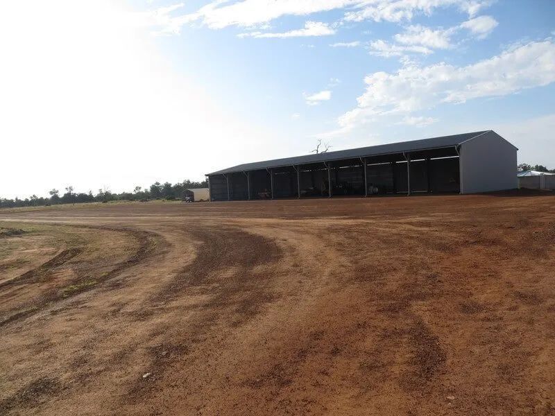 Dirty Road With Waiting Shed Besides It — Mike Barlow Earthmoving Pty Ltd in Rockhampton, QLD