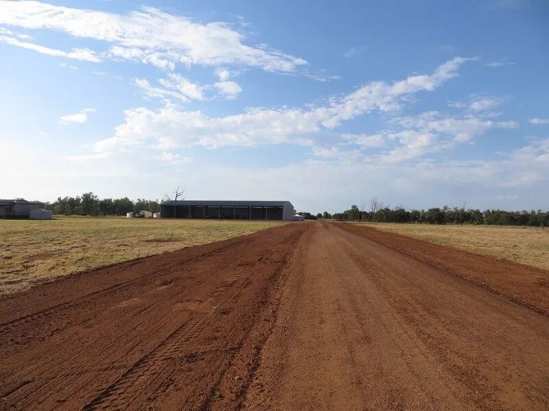 Wide View Of Dirt Road With Sky In Background — Mike Barlow Earthmoving Pty Ltd in Rockhampton, QLD