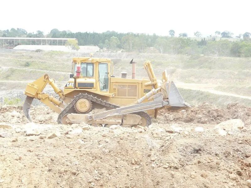 One Yellow Bulldozer In The Construction Site — Mike Barlow Earthmoving Pty Ltd in Rockhampton, QLD