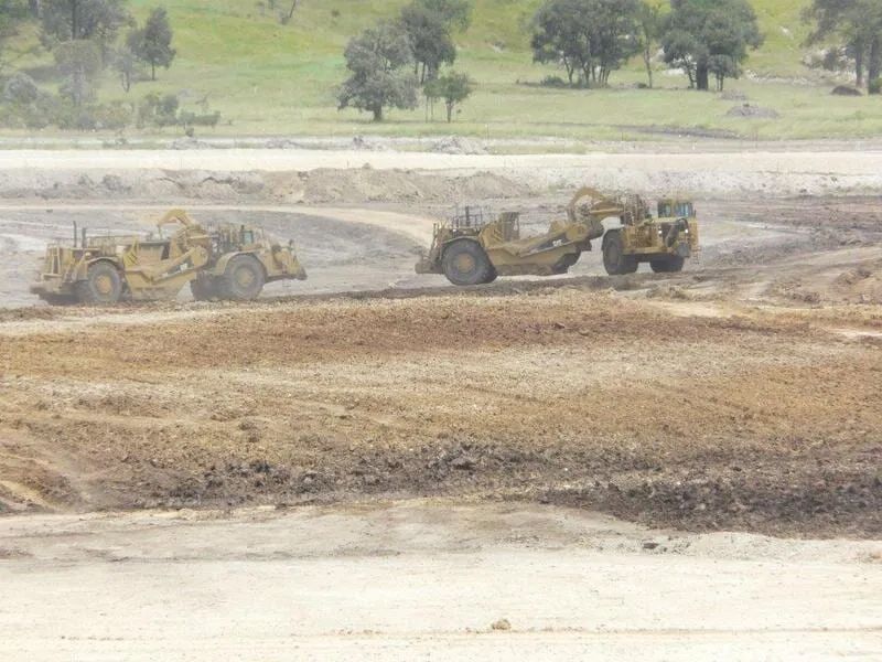 Excavator at Work in the Field — Mike Barlow Earthmoving Pty Ltd in Rockhampton, QLD