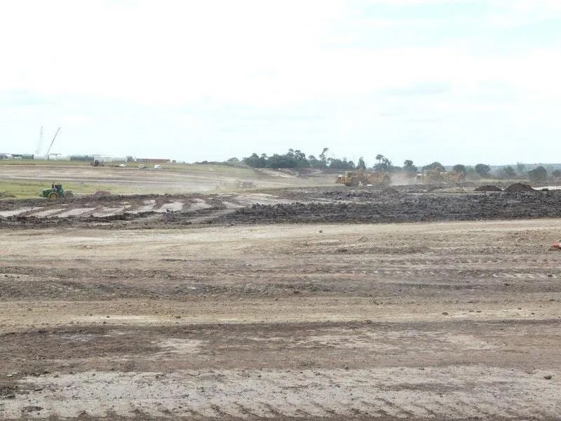 Bulldozer Working On Dam Field For Construction — Mike Barlow Earthmoving Pty Ltd in Rockhampton, QLD