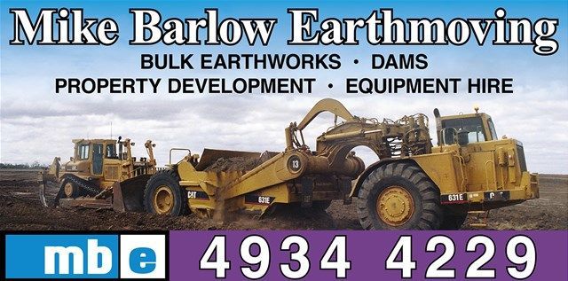 A Yellow Bulldozer Is Parked on Top of A Dirt Field — Mike Barlow Earthmoving Pty Ltd in Central Highlands, QLD