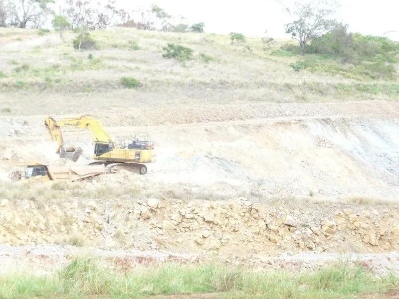 Heavy Machine Digging a Deep Hole — Mike Barlow Earthmoving Pty Ltd in Rockhampton, QLD