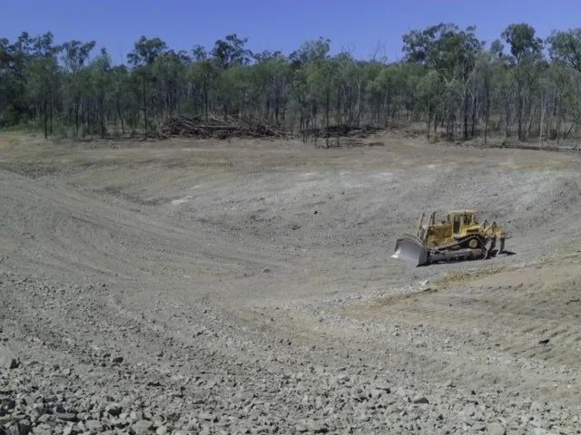 Bulldozer Cleaning A Dam For A Construction — Mike Barlow Earthmoving Pty Ltd in Rockhampton, QLD