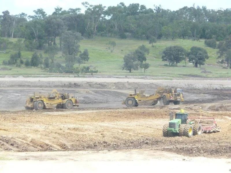 Three Excavator In The Construction Field — Mike Barlow Earthmoving Pty Ltd in Rockhampton, QLD