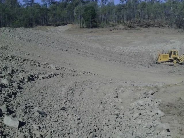 Land Is Being Cleaned With The Bulldozer — Mike Barlow Earthmoving Pty Ltd in Rockhampton, QLD