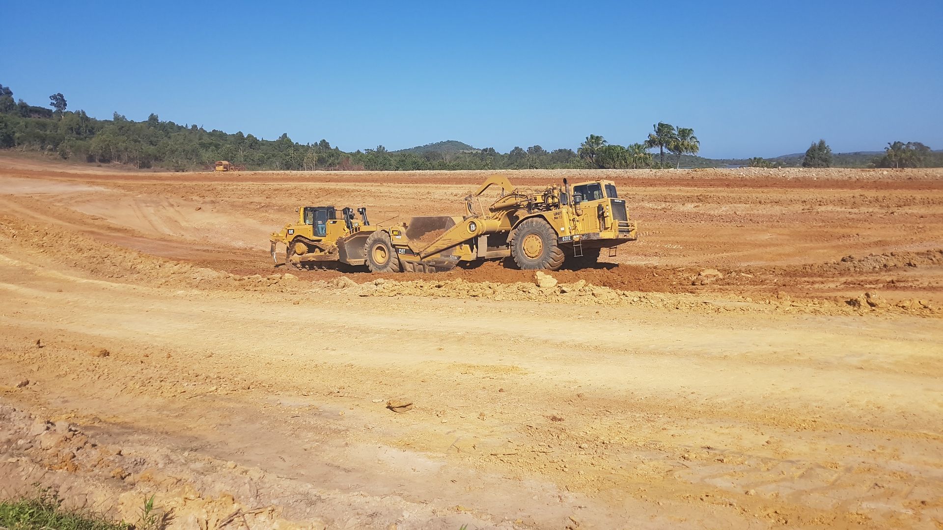 A Large Yellow Bulldozer On A Construction Site — Mike Barlow Earthmoving Pty Ltd in Rockhampton, QLD