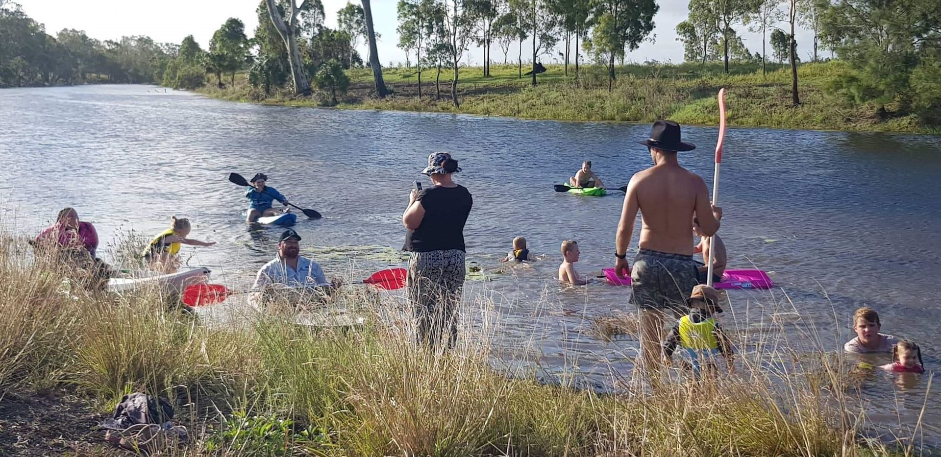 A Person Is Riding a Motorcycle Down a Dirt Road — Mike Barlow Earthmoving Pty Ltd in Rockhampton, QLD