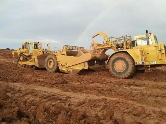 Two Bulldozers Are Driving Through a Quarry — Mike Barlow Earthmoving Pty Ltd in Rockhampton, QLD