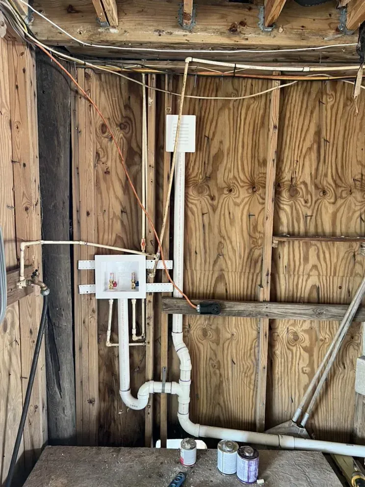 A room with a lot of pipes coming out of the wall.