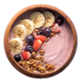 Acai bowl with banana slices, blueberries, strawberries, and granola in a wooden bowl.