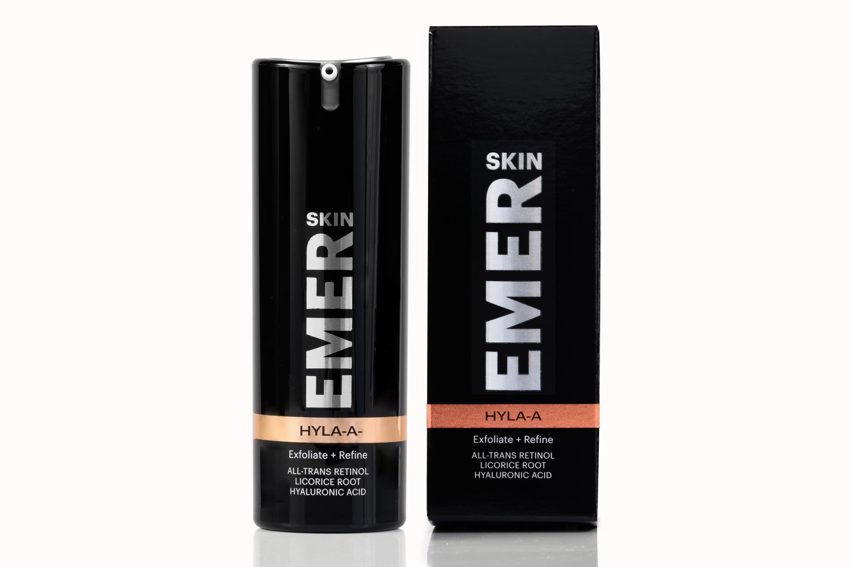 A bottle of emer skin next to a box