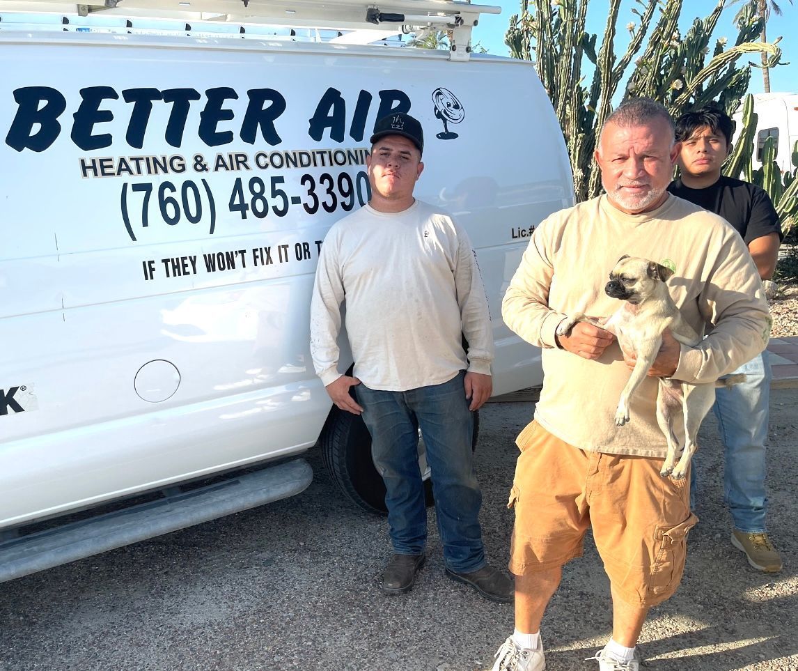 Three men standing in front of a better air van