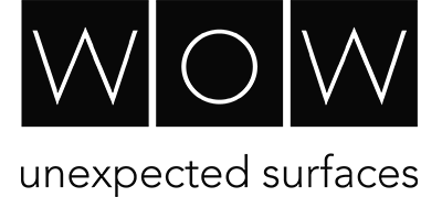 A black and white logo for wow unexpected surfaces.