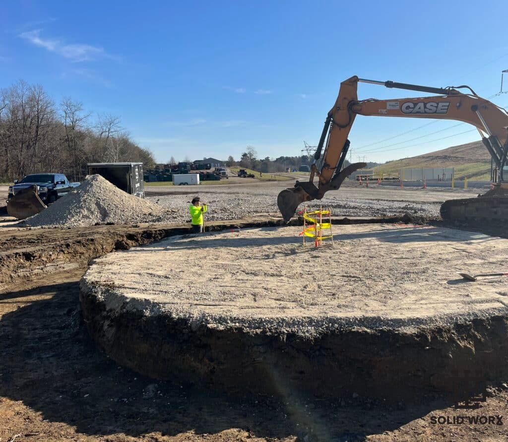 A large excavator is digging a hole in the ground.