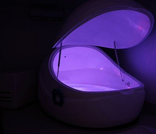 A White Container With The Lid Open And Purple Lights Coming Out Of It — The Enchanted Wolf Holistic Port Macquarie, NSW