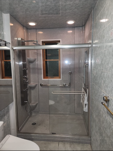 shower next to toilet for mobility use 