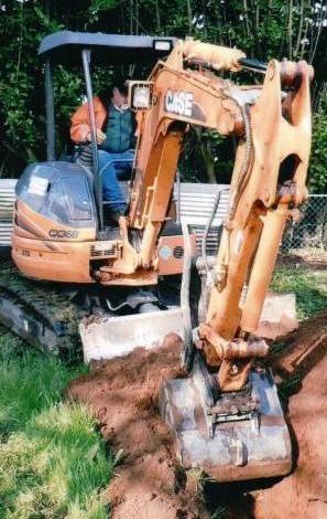 Man using Excavator Machine — Septic Tank Services in Kent, WA