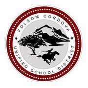Folsom Cordova Unified School District seal: Mountains, tree, rider on horse, and text in a red and white circle.