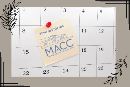 Calendar with a note pinned on it, advertising a visit to the MACC.