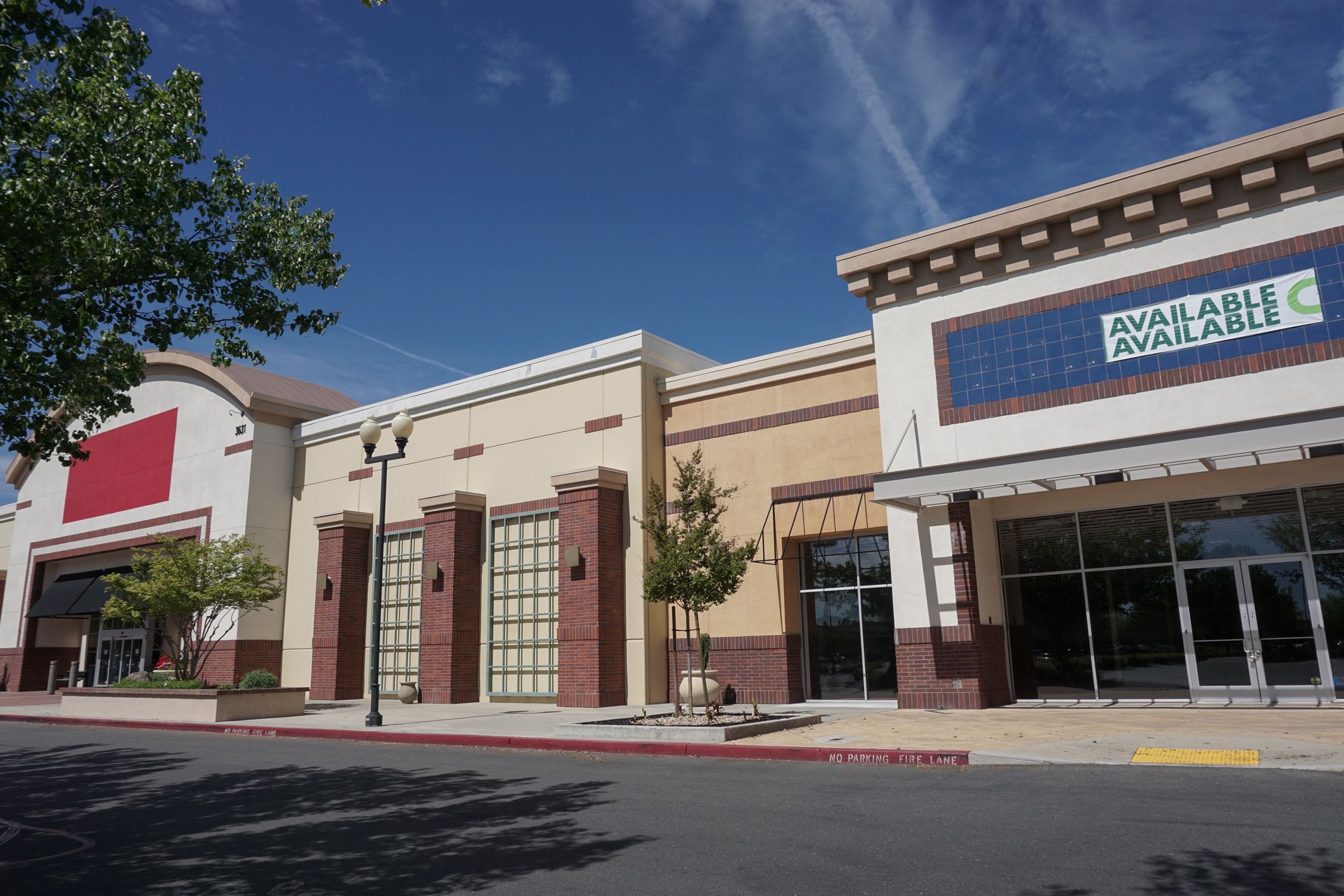 A row of buildings with a sign that says available available