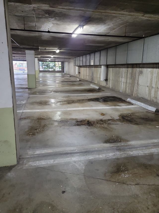 There are a lot of parking spaces in this parking garage.