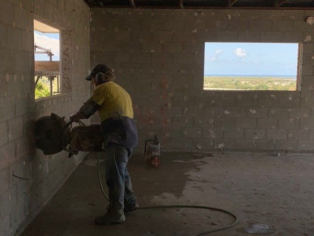 Worker Cutting Concrete Wall — Concrete Cutting In West Mackay, QLD