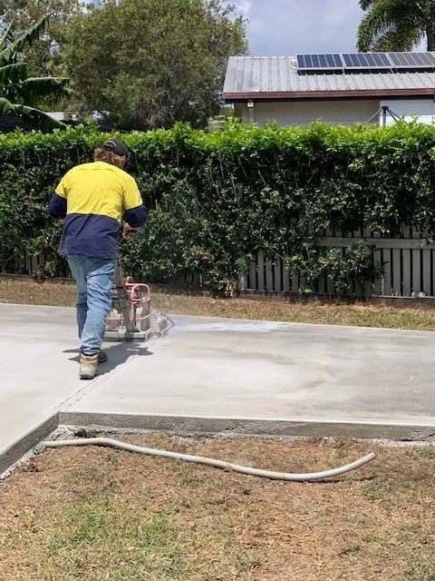 Worker Using Tool To Cut Concrete Floor — Concrete Cutting In West Mackay, QLD