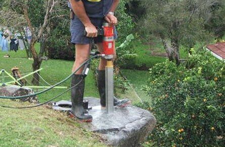 Man Drilling Into Rock — Concrete Cutting In West Mackay, QLD