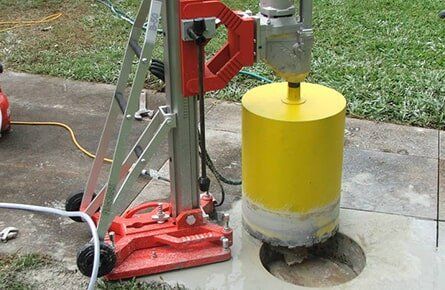 Yellow Drilling Machine — Concrete Cutting In West Mackay, QLD