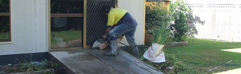 Cutting Concrete Floor In Front OF the Door — Concrete Cutting In West Mackay, QLD