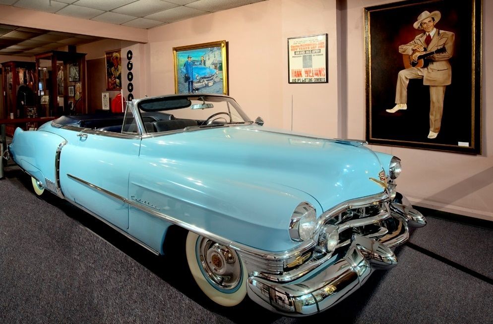Hank's Cadillac convertible is displayed in a museum
