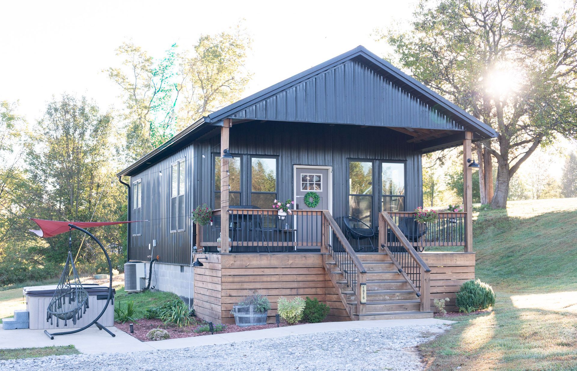 A bedroom with a king size bed and a window.
