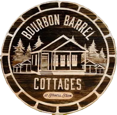 A wooden sign that says bourbon barrel cottages on it