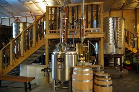 A brewery with barrels and stairs in the background