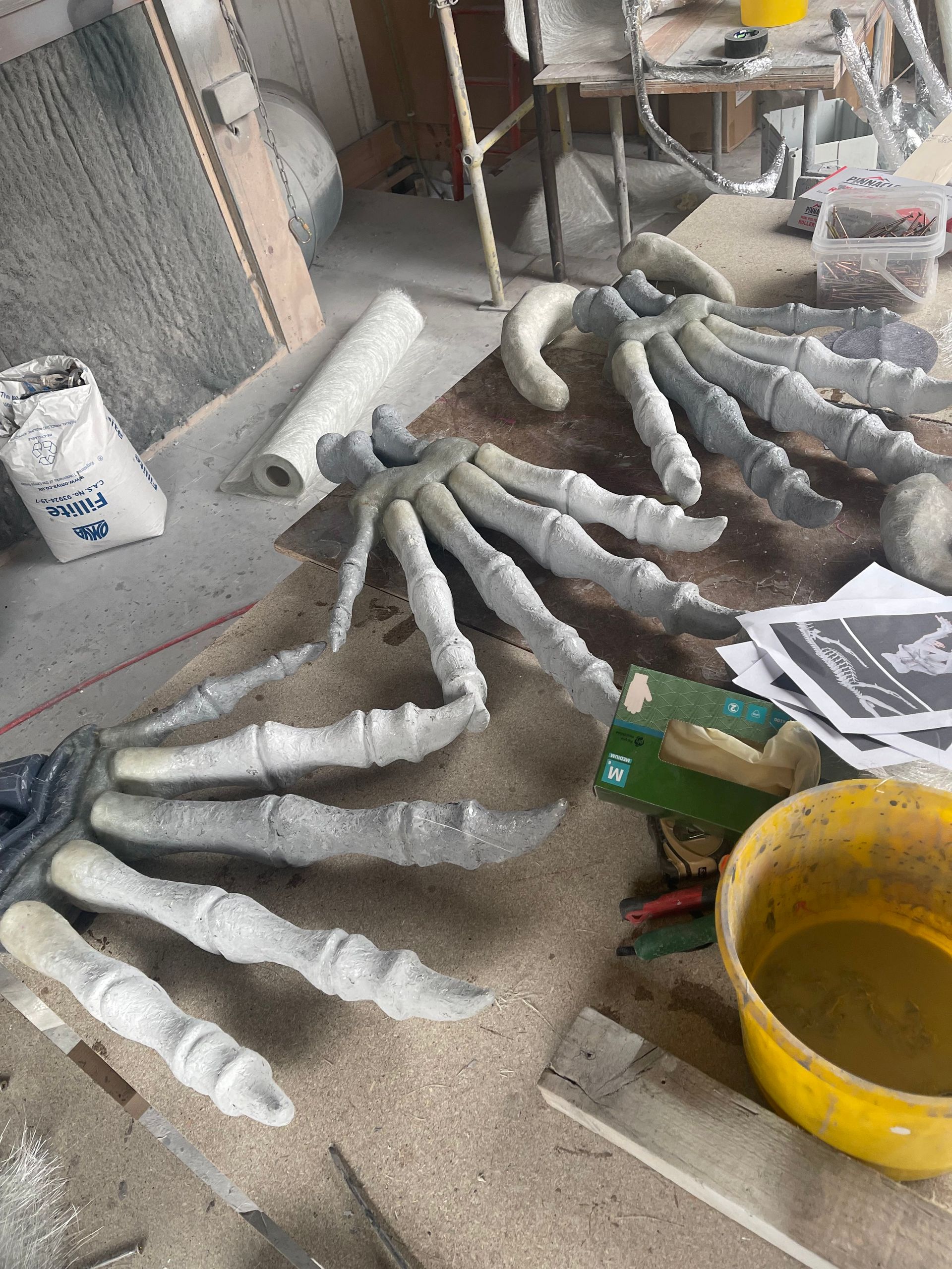 3D printed dinosaur fingers prop in workshop