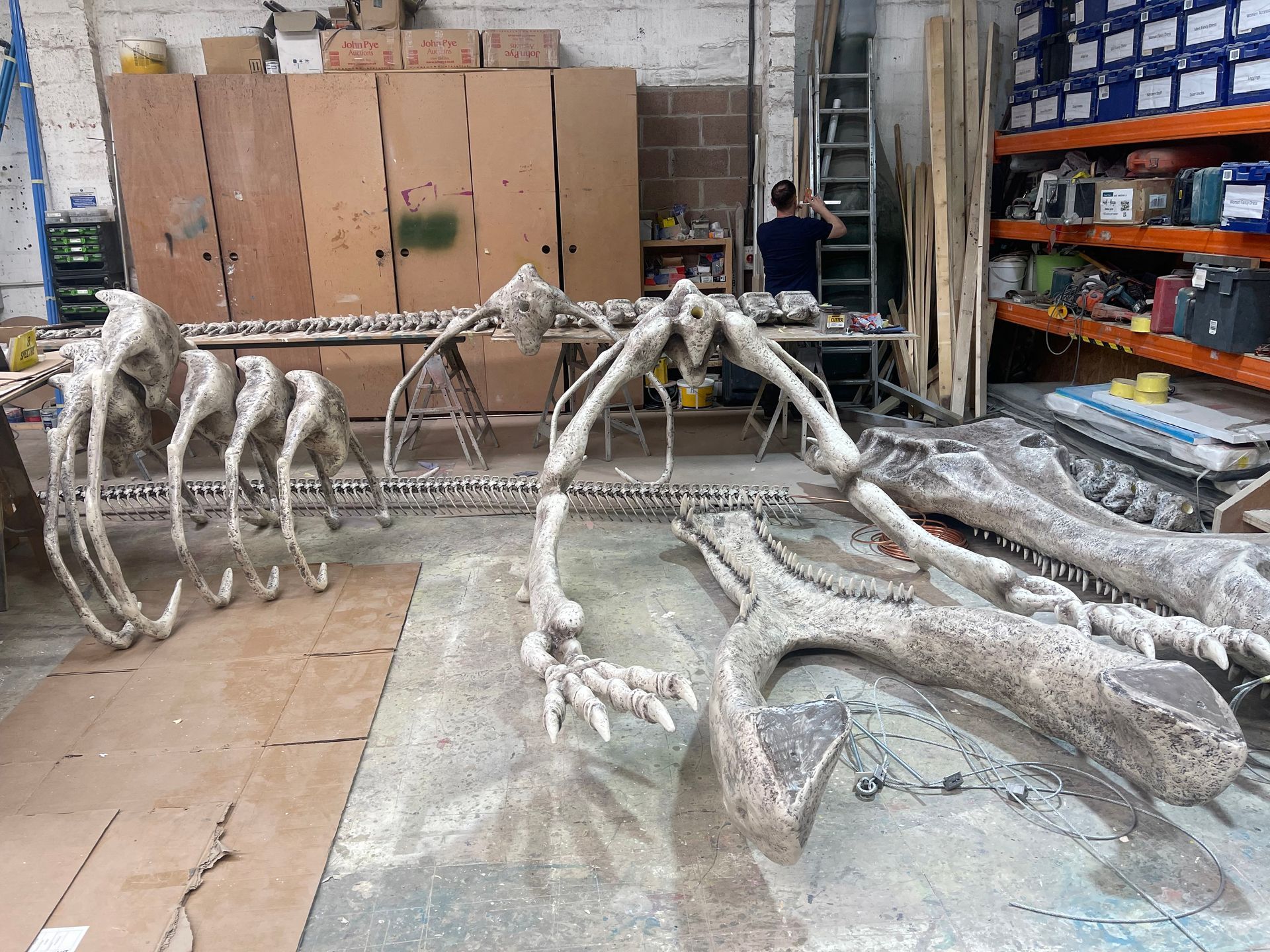 large-scale 3D printed dinosaur prop in construction