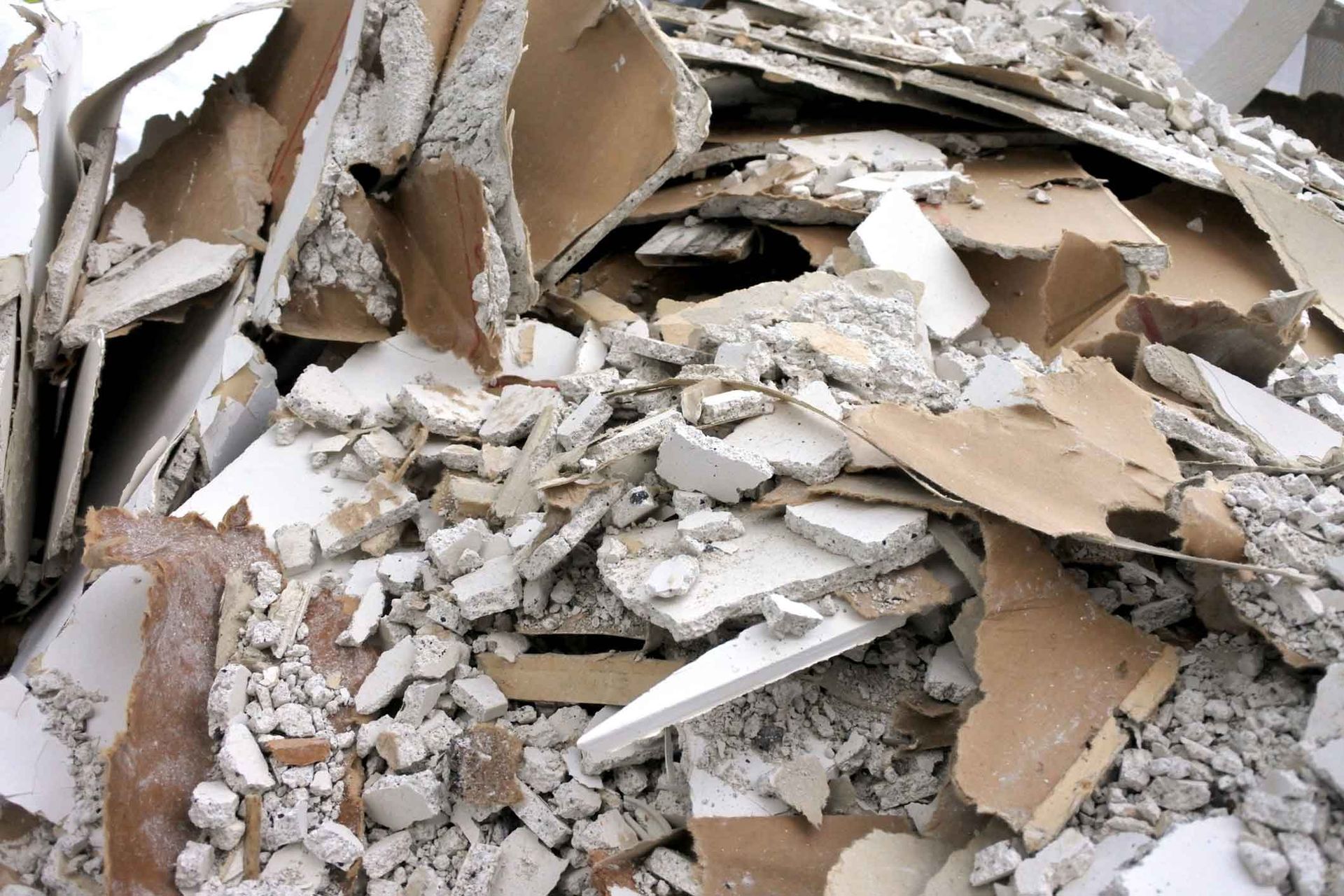 A pile of broken pieces of cardboard and concrete