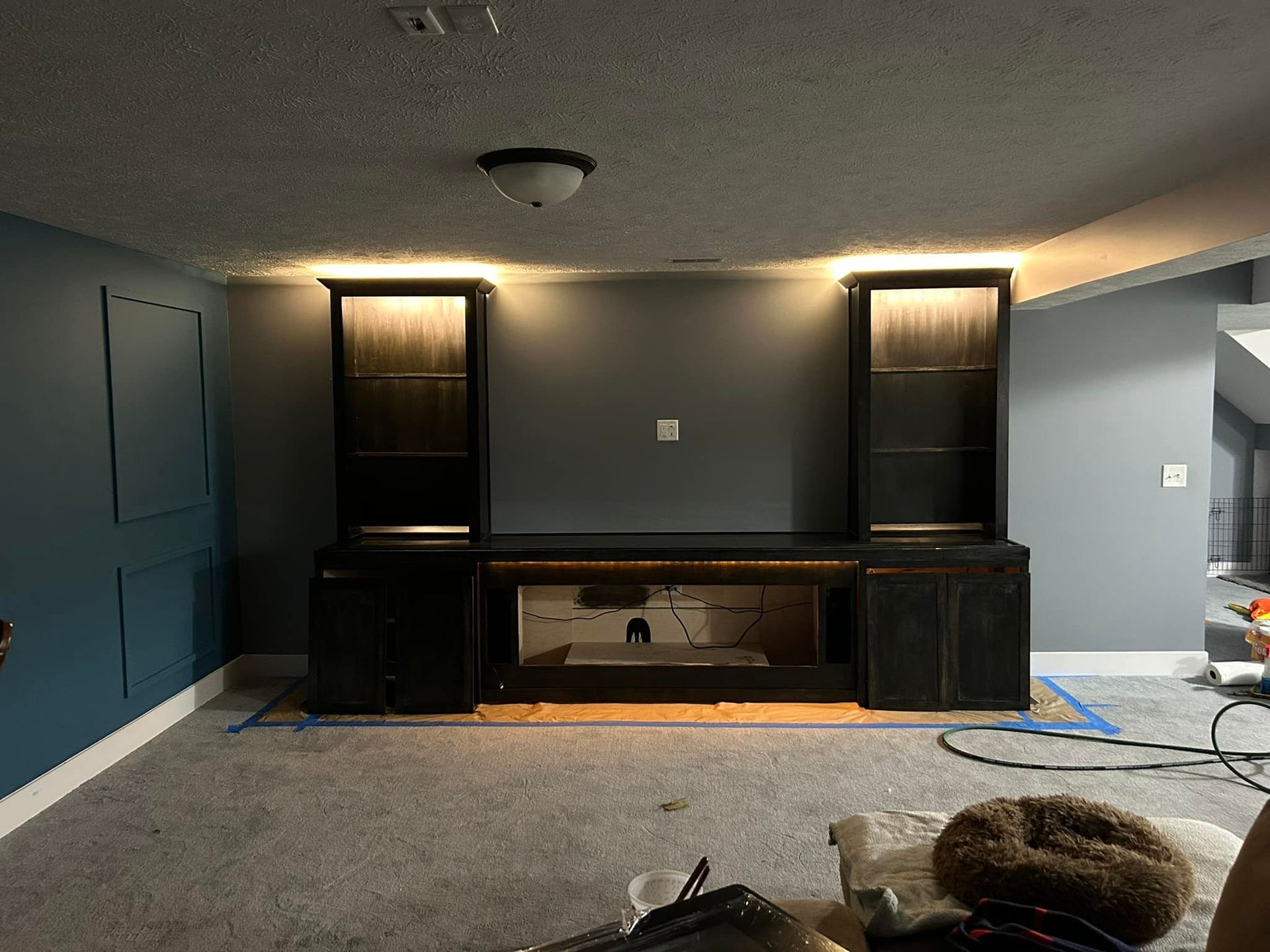 A living room with a lot of furniture and a fireplace.