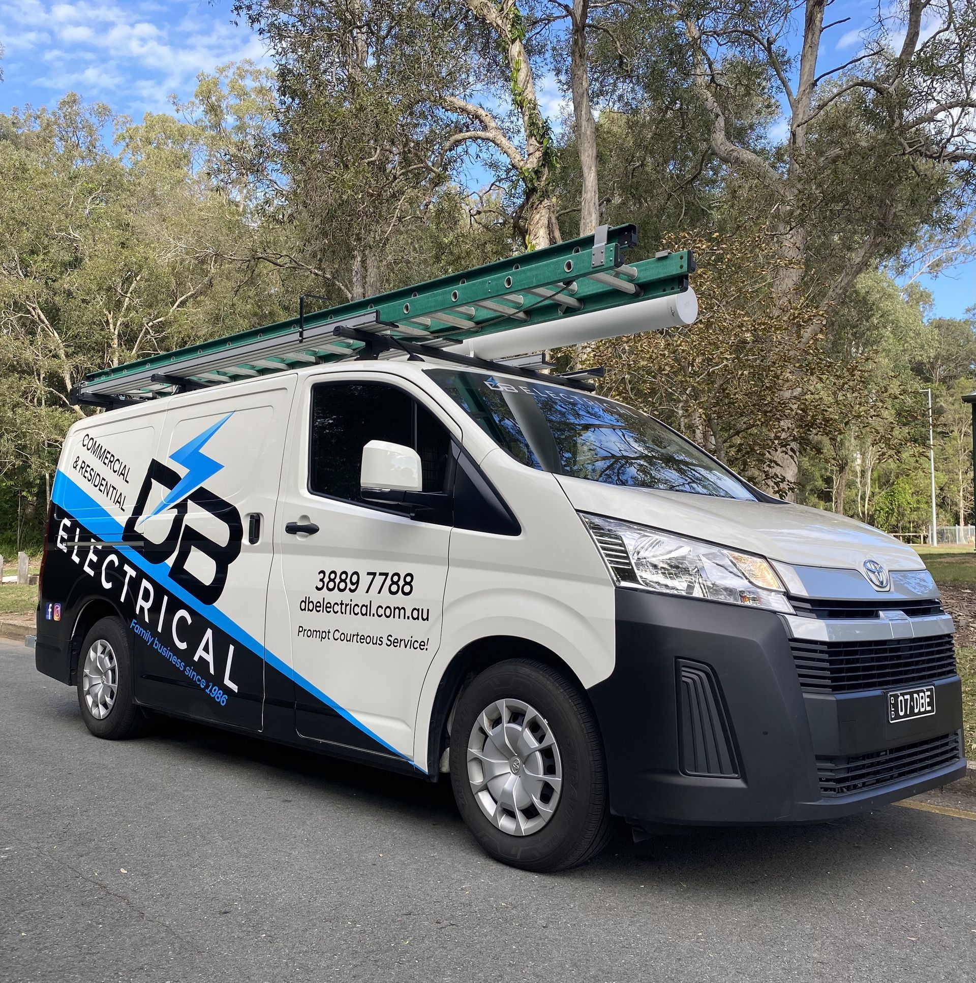 A White Van With A Ladder On Top Of It Is Parked On The Side Of The Road – Brendale, QLD - DB Electrical