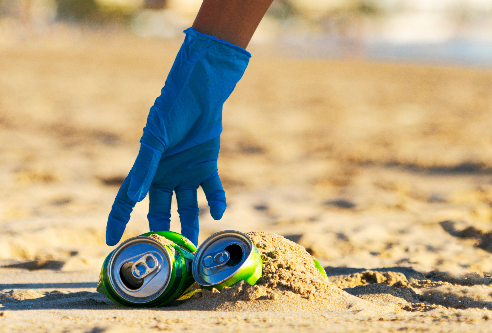 A lighthouse is lit up in the middle of the ocean at night.