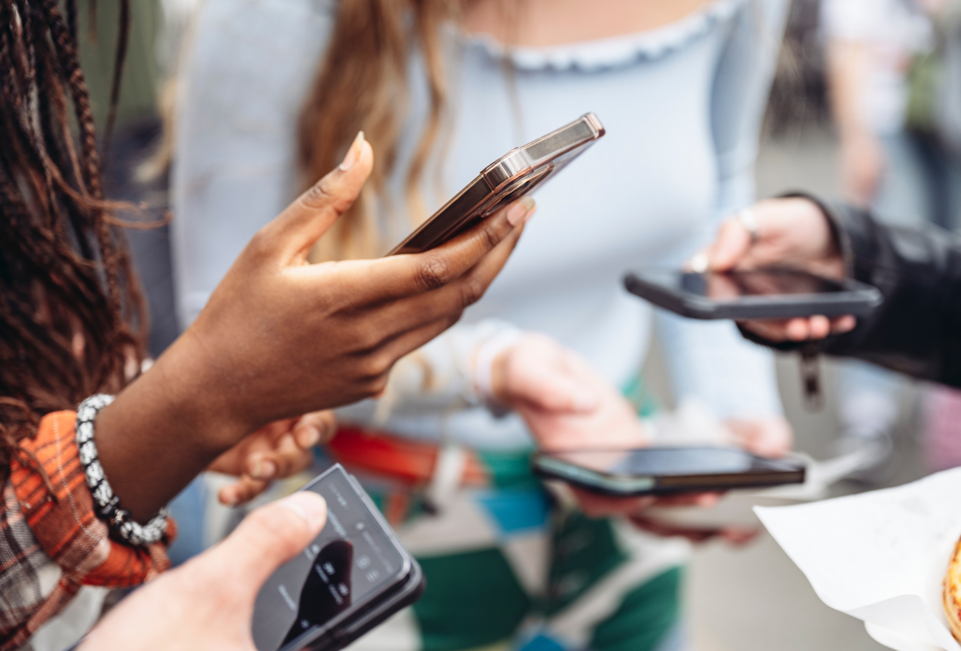 A boat is going down a river with a building in the background