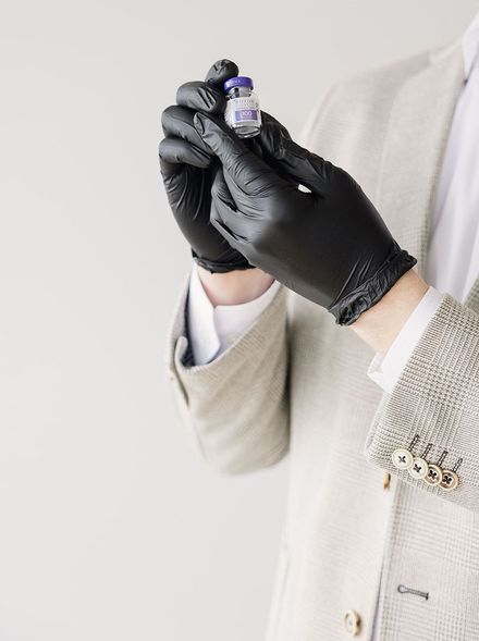 Nurse Practitioner holding a vial of Botox 