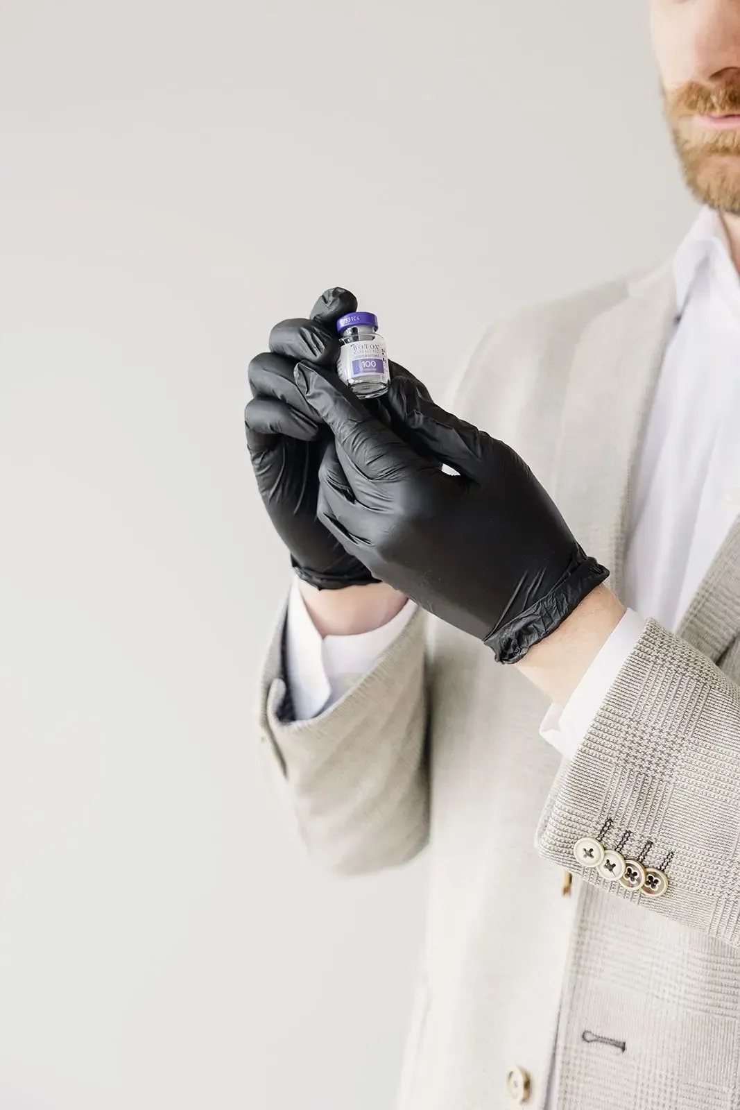 Nurse Practitioner holding a vial of Botox