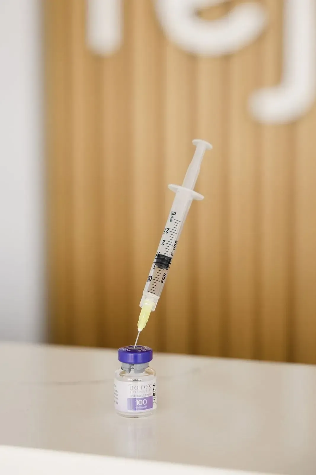 Syringe with botox bottle.