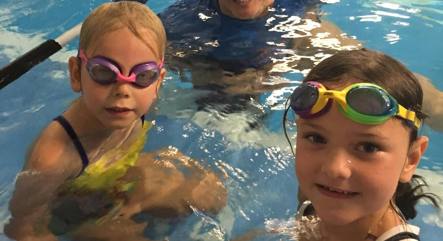 Two Girls With Swimming Instructor — Swim Care Boambee in Boambee, NSW