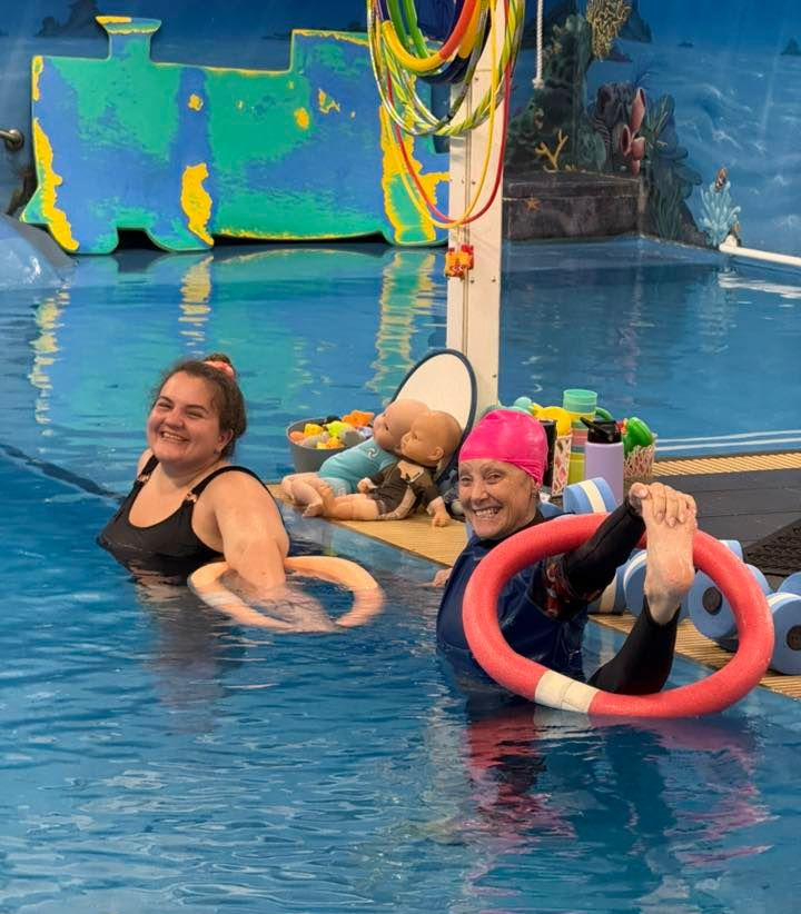 Two women in a pool exercising with flotation devices — Swim Care Boambee in Coffs Harbour, NSW