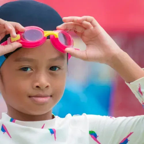 Girl Wearing Swimming Cap and Goggles — Swim Care Boambee in Coffs Harbour, NSW