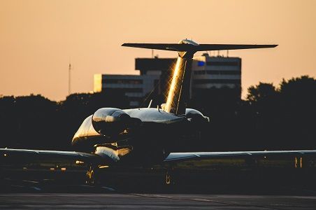 general aviation private jet in sunset