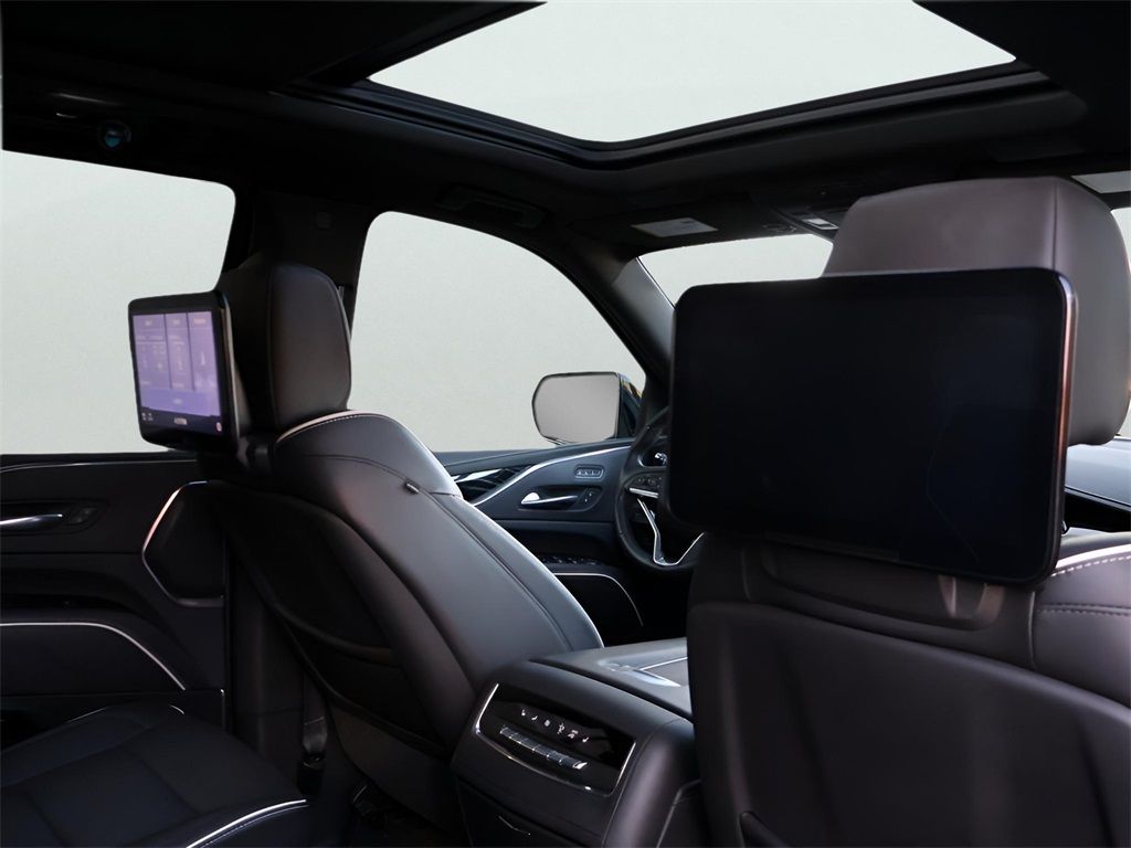 A black and white photo of a row of cars parked next to each other.